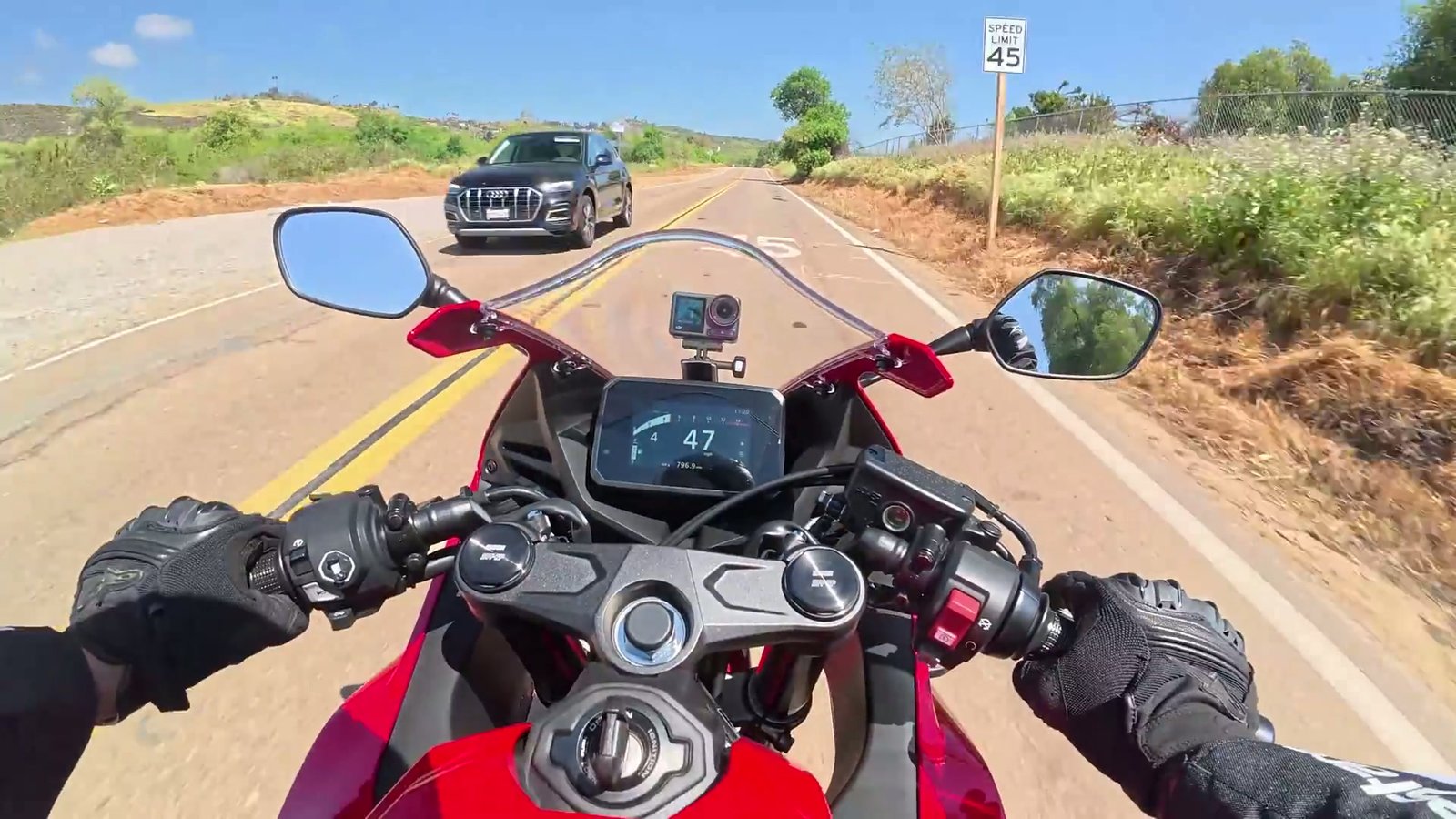 Detailed view of the 649cc inline four engine highlighting its dual overhead cam and cooling system.